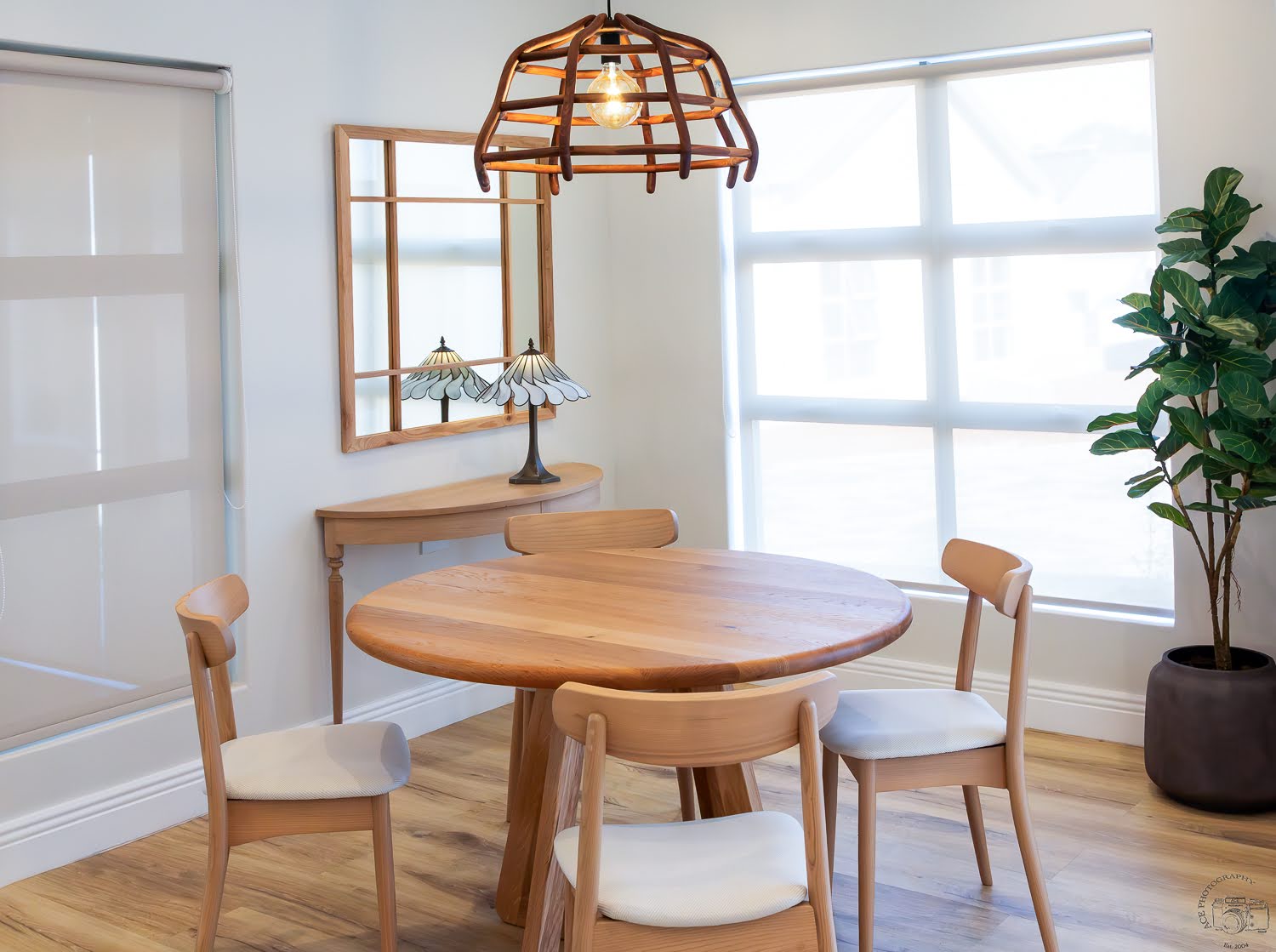 Ballito interior design dining area with custom solid oak table, dining chairs and bespoke wooden pendant.